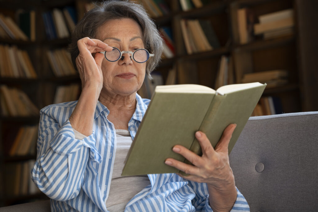 a old woman struggle to read the book nearly