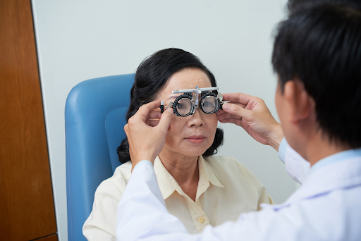 old woman checking eye